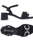 Pair of Dark navy block heel sandals with thin ankle buckle strap and two silver linked circle designs on toe strap.