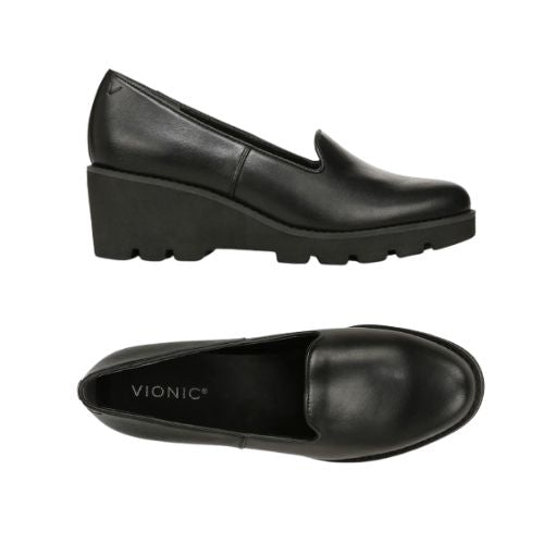 Side and top view of black Vionic Willa Wedge women's shoe showing sleek leather upper and supportive wedge heel for all-day comfort.