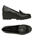 Side and top view of black Vionic Willa Wedge women's shoe showing sleek leather upper and supportive wedge heel for all-day comfort.