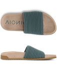 Pair of soft blue slide sandal with compression style knit upper, microfiber sculpted tan Vionic Logo'd foot bed and brown flat rubber outsole.