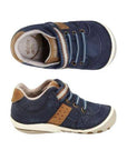 Pair of Leather sneakers in navy with brown accents, elastic laces and hook-and-loop strap and white outsole.