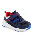 Childrens navy sneaker with durable leather, white sole, red and blue details, and a Velcro strap.