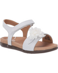 White backstrap sandal with oversized flower detail on front strap.
