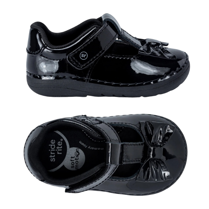 Pair of Black Patent kids Mary-Janes with Velcro closures, Black SR logo'd black footbed and patent bow on toe.