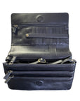 Inside black leather cross body bag showing multiple compartments and card slots.