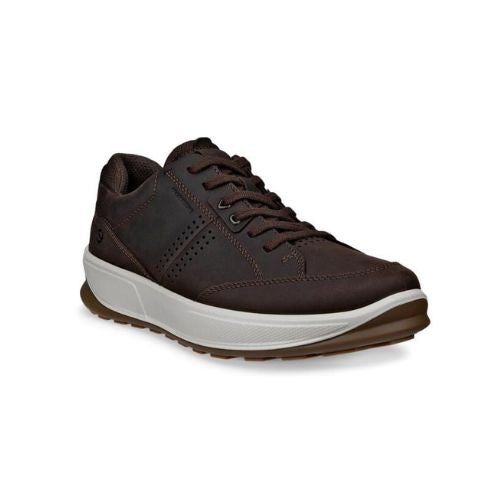 Brown leather sneaker with thick white midsole and brown outsole.
