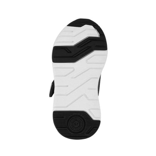Black and white sneaker sole with textured geometric patterns and a memory foam footbed, viewed from underneath.