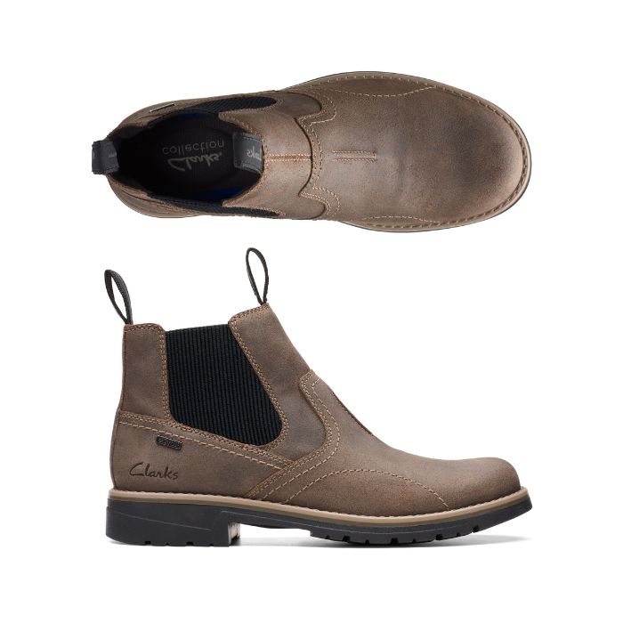 Stone brown Chelsea boot with dark elastic goring, heel pull tabs and outsole. Clarks logo on heel of insole.
