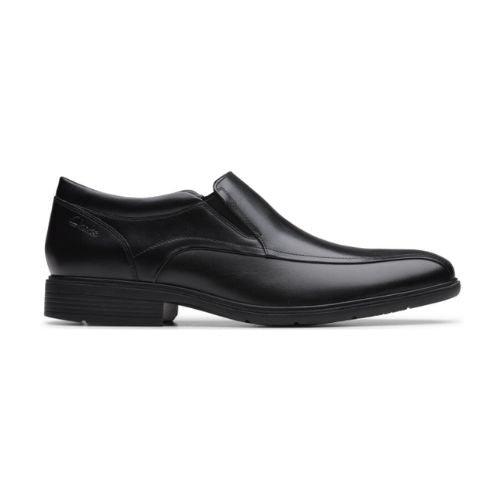 A black slip-on dress shoe with a leather upper and a rubber outsole.