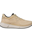 Profile of an Ecco light beige leather sneaker with black accents in beige laces. Lining is black. Midsole is white, outsole is black.