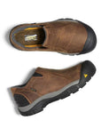 Pair of Brown leather slip-on shoes with black rubber heel and toe bumper connected to the black rubber outsole.