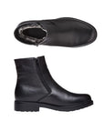 Pair of Men's black leather ankle boots with zippers on each side, faux fur lining and a black treaded outsole.