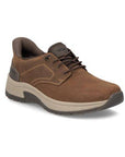 Brown leather slip on shoe with dark brown accents, elastic laces, accent stitching, thick beige midsole and dark brown outsole.