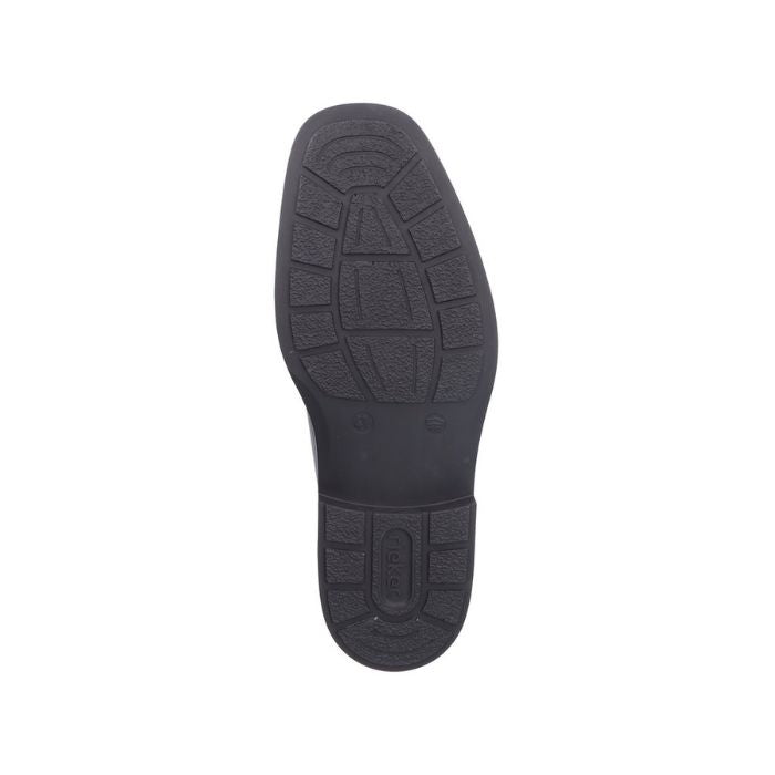Outsole view of the Rieker B0011 men's dress boot featuring a flexible, textured rubber sole for traction and comfort.