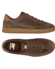 Pair of brown suede sneakers with matching brown laces, accent stitched panels, Sorel logo'd footbed and a gum rubber outsole.