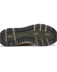 Outsole of brown Dunham Glastonbury Ubal II Sneaker with deep tread pattern for waterproof grip and outdoor stability.