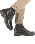 Model wearing black Double Zip Boot with beige pants.