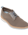 Soft grey semi-dress knit shoe with blue accent laces, blue heel cap, white midsole and blue outsole.