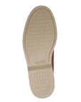 Beige light treaded dress shoe outsole with Clarks logo stamped in middle.