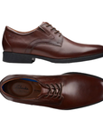 Pair of Brown Mahogany leather derby dress shoes with stitching details, tan Clark's logo'd footbed and low heel.