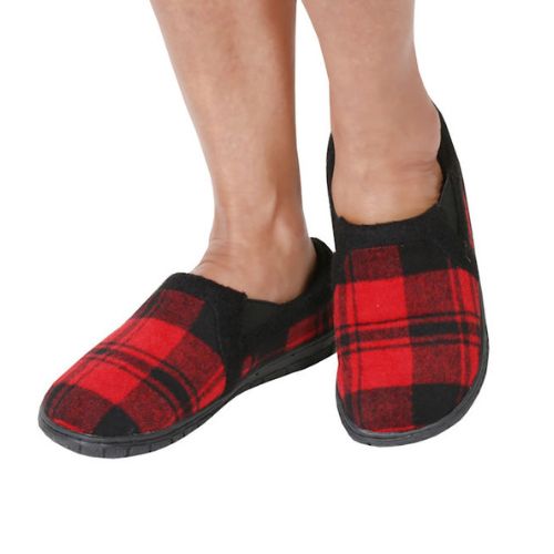 Model posing wearing the red plaid Jacob Slippers.