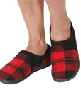 Model posing wearing the red plaid Jacob Slippers.