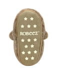 Beige suede outsole of slipper with star patterns and 'ROBEEZ' branding.