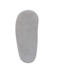 Grey suede outsole of baby shoe.