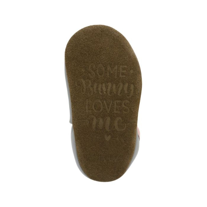 Brown Suede outsole with words "Some Bunny Loves Me" and "Robeez" stamped on.
