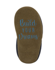 Brown suede outsole with 'Build Your Dreams' text.
