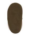 Brown suede outsole of baby shoe with Robeez logo on heel.