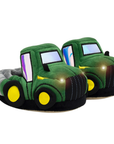 Green tractor-shaped slippers with working headlights.