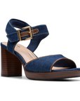 Women's Clarks AmbyrLyn Faye sling-back sandal in denim with 75mm block heel and adjustable strap, perfect for stylish comfort.