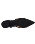 Black light treaded outsole of pointed toe shoe with low block heel.
