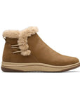 A brown ankle boot with faux fur trim and a flat beige outsole.