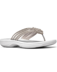 Silver thong sandal with multiple decorative straps covered in rhinestones, white Clarks logo'd footbed and thick cushioned outsole.
