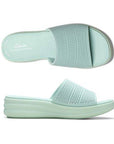Top and side views of mint green Clarks Drift Twist Slide Sandals for women, showcasing breathable vegan material and contoured footbed.