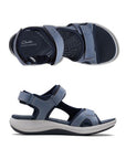 Side and top views of Women's Clarks Mira Bay Sport Sandal in blue, showcasing lightweight design and flexible sole.