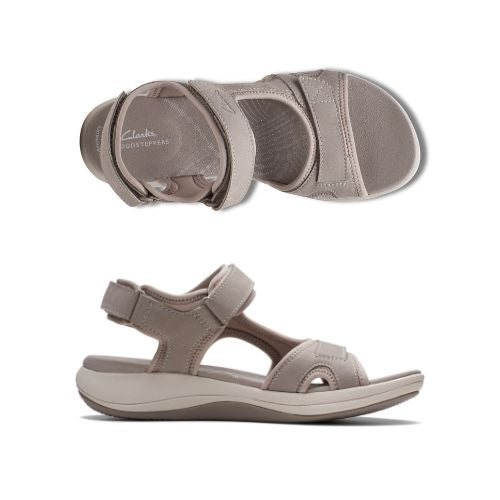 Top and side views of beige Women's Clarks Mira Bay Sport Sandal, designed for flexibility, support, and everyday wear.