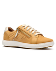 Yellow sneaker with gold side zipper, white laces, white heel accent, white midsole and brown outsole.