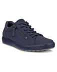 A navy blue nubuck lace sneaker with a side zipper, blue midsole and tan outsole.