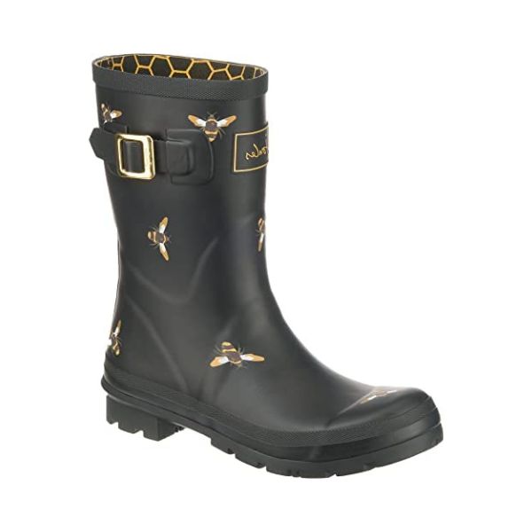 Molly Mid-Height Welly in Black Bees. Black rubber boot with yellow accents and a black outsole. Features a decorative gold buckle. Upper has painted-on yellow bees.