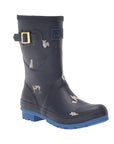Molly Mid-Height Welly in Navy. Navy blue rubber boot with light blue accents and a light blue outsole. Features a decorative gold buckle. Upper has a painted-on dog pattern.