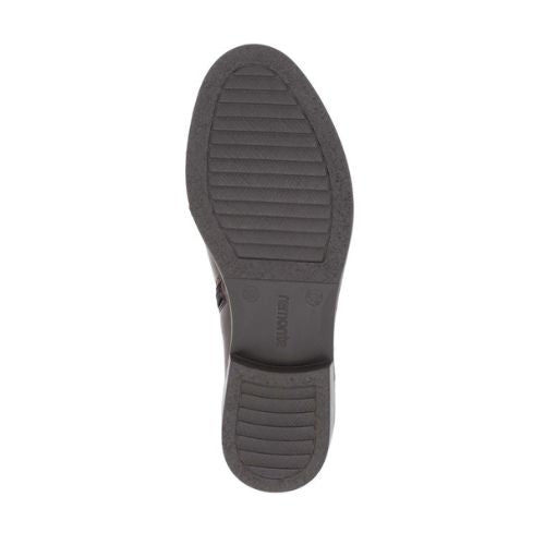 Brown light treaded outsole with Remonte logo stamped in middle.