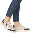 Model wearing Women's Remonte D2E04 Lace-Up Sneakers with jeans, showcasing stylish and comfortable fit for everyday use.