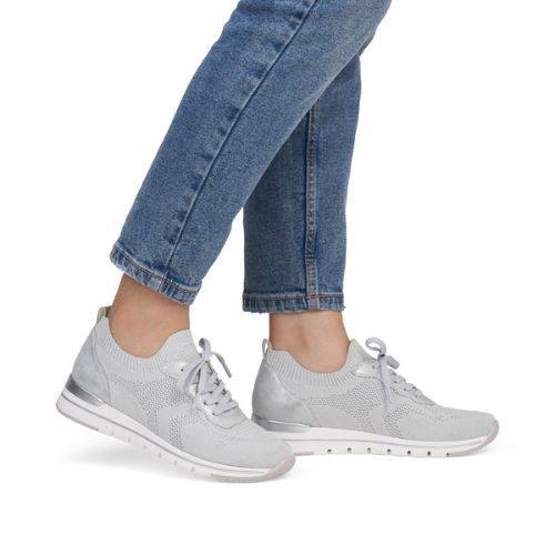 Model wearing light grey Women's Remonte R6712 Slip-On Sneakers with jeans, showcasing casual style and comfort fit.