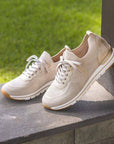 Beige Women's Remonte R6712 Slip-On Sneakers displayed outdoors, highlighting breathable knit design and sporty silhouette.