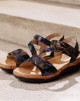 Women's Remonte R6860 Backstrap Leather Sandals displayed on steps, highlighting multicolor pattern and waterproof leather finish.