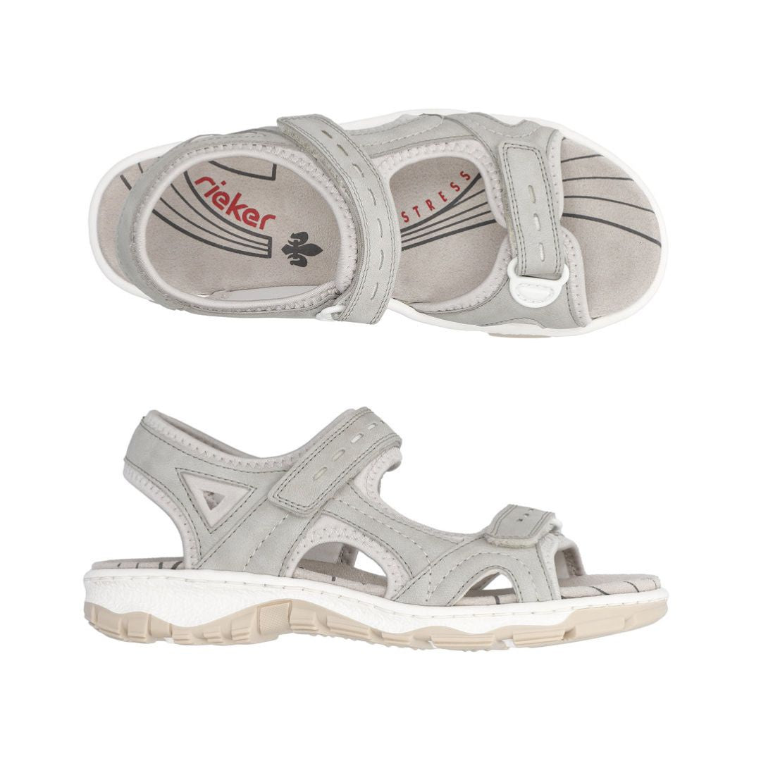 Top and side views of Women's Rieker 68866 Backstrap Sandal in grey, showing adjustable Velcro straps and shock-absorbing footbed.