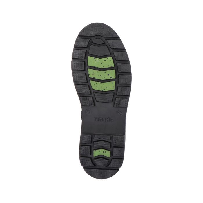 Black rubber outsole with green ice grip inserts.